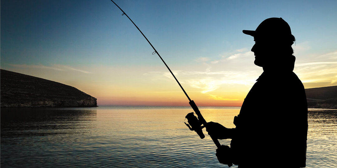 Fisker i solnedgang